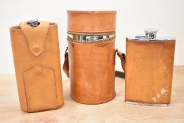 A 20th century travelling curved hip flask within a fitted leather carry case, h19.5cm, sold