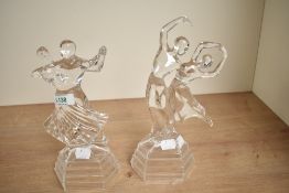 A pair of vintage crystal glass ballroom dancer studies, measuring 25cm and 27cm.