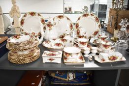 A Royal Albert Old Country Rose pattern dinner service, decorated with gilt edging and floral