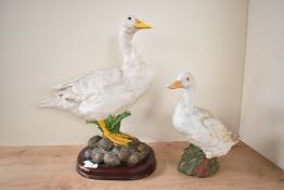 A Leonardo Collection porcelain duck study measuring 42cm tall sold alongside a similar porcelain