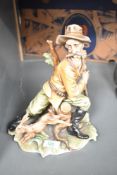 A rare Tyche Tosca Capodimonte figure of 'The Hunter and Rabbit', signed to base, H27cm