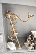 An early 20th century part brass chandelier decorated with floral and leaf motifs, H86cm