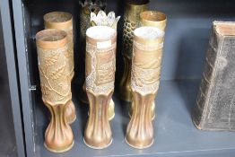 Four pairs of good French World War I 75DEC Trench Art shell cases, one pair decorated in the