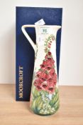 A Moorcroft Amberwood pattern pottery pitcher, painted marks to base, signed by Rachel Bishop,