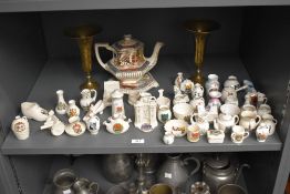 A pair of early 20th century brass vases of trumpet form, decorated with engraved floral patterns,