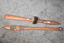 A tribal hand club style Taiaha, carved with inlaid mother of pearl paua eyes, L91cm