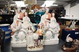 A pair of 19th century Staffordshire flatback clock face figures depicting Bonnie Prince Charlie,