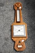 An Art Deco style mahogany barometer, having thermometer scale, h62cm Condition report: Damage to