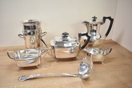 An 4 piece silver plated tea set raised on simple swept supports, to include tea pot, coffee pot and
