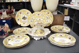 A set of 9 porcelain service plates, decorated with gilt edging, hand coloured with pheasants and