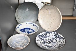 A oriental ceramic bowl decorated with blue Koi fish on a white ground, w23cm, sold together with