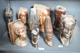A group of African wooden busts, hand carved in ebony, to include tribal figures, bookends ect, (