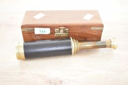 A vintage brass and leather 3 draw refractor telescope with wooden box, L19cm