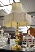 A brass table lamp having silk shade, h80cm