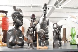 A group of African tribal figures, hand carved in ebony, to include a female bust ect, ( 8 ).