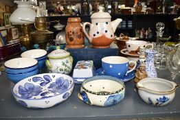 A clay pottery tea pot with cover, decorated with polka dot patterns on a white glaze ground, h21cm,