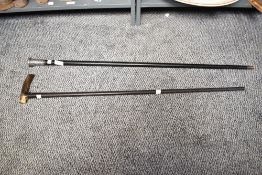 An early 20th century ebonised walking stick, having a silver mounted top decorated with acanthus