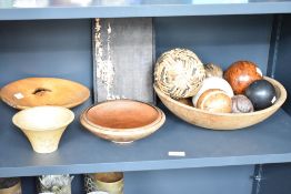 A large turned wooden fruit bowl, w33cm, sold together with various other bowls and wooden fruit