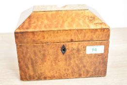 A 19th century maple / walnut tea caddy of Sarcophagus form, missing interior and key, h14cm
