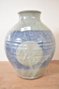A blue and white salt glazed stoneware vase of baluster form, covered in colbalt and pale grey