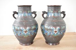 A pair of late 19th / early 20th century Chinese bronze Urns of baluster form, decorated with Foo