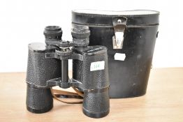 A single pair of binoculars with leather strap, factory mark '7x50 MADE IN USSR', suede lined