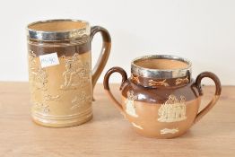 A Victorian Royal Doulton Lambeth stoneware tankard, having silver rim top dated for Sheffeild