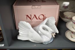 A large Nao by Lladro porcelain study 'The Little Swan' number 1358, sold with box.