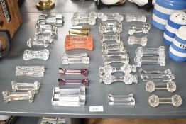 A group of glass knife rests in various shapes, colours and sizes, (40)