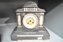 A 19th century black slate Quartz mantel clock having enable dial and Roman numerals, h31.5cm