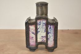An early 20th century Chinese pewter tea cannister, decorated with glass inserts over traditional