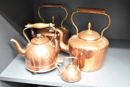 A pair of early 20th century copper kettles having shaped spout and handle, H31cm, sold together