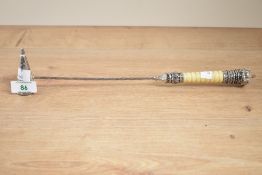 A silver plated candle snuffer, having twist neck and crown handle, L34cm