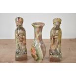 A pair of Chinese carved hard stone Confucius style figures, displayed on a square base seen