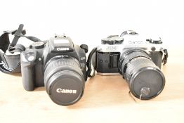 A Canon digital 'AE-1 Program' camera, sold together with another Canon camera, (2)