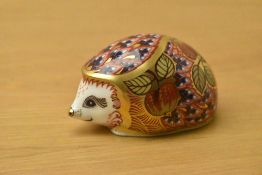 A Royal Crown Derby bone china exclusive Orchard Hedgehog paperweight, having Imari Style decoration