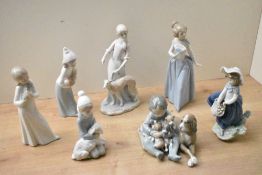 A group of seven Lladro porcelain and Nao by Lladro porcelain figures/figurines including 'Lady