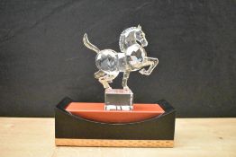 A Swarovski Crystal Chinese Zodiac Horse, complete with box and display stand.