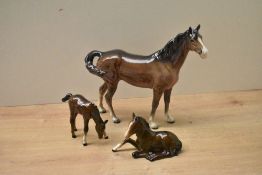 A Beswick Pottery 'Swish Tail Horse' model number 1182 (First Version) by Arthur Gredington in brown