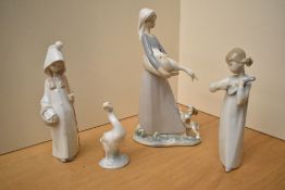 A group of four Lladro porcelain figurines/studies comprising 'Girl with Mandolin' model number