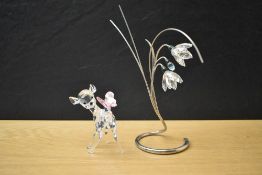 A Swarovski Crystal Disney's Bambi sold alongside a Swarovski Crystal 'Damarys Erinite' flower