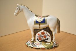 A Royal Crown Derby limited edition bone china paperweight, Race Horse having Imari style decoration