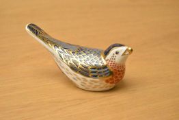 A Royal Crown Derby bone china Bluebird paperweight, having Imari style decoration and gold coloured