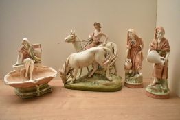 A group of four continental porcelain figures ,in the manner of Royal Dux, depicting various