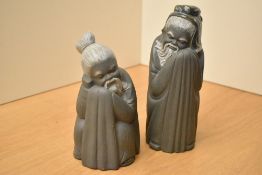 A pair of Lladro porcelain monks, model numbers 2056 and 2057, largest measures 21cm.