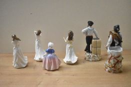 A group of four Royal Doulton bone china figurines comprising 'Embrace' HN 4258, 'Sentiments