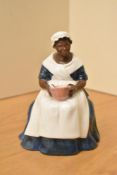 A Royal Doulton bone china figurine 'Royal Governor's Cook', model number HN 2233, measures 16cm.