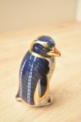 A Royal Crown Derby bone china Rockhopper Penguin paperweight, having Imari style decoration and