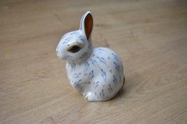 A Royal Crown Derby bone china Snowy Rabbit paperweight, having Imari style decoration with gold