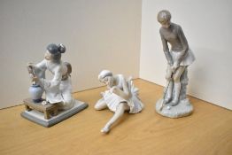 A group of three Lladro porcelain figurines comprising 'Ballett Purple' model number 1356 with